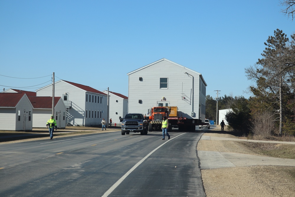 Contractors move fourth World War II-era barracks to new location in April 2023