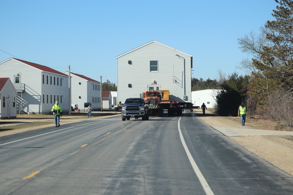 Contractors move fourth World War II-era barracks to new location in April 2023