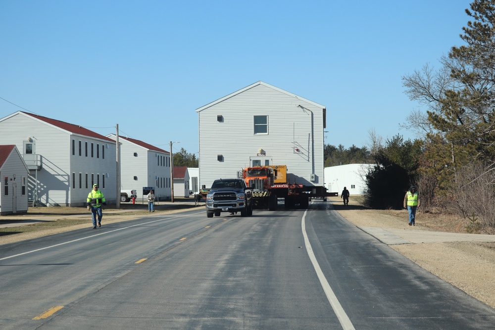 Contractors move fourth World War II-era barracks to new location in April 2023