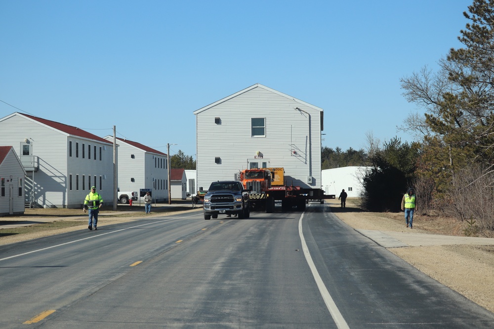 Contractors move fourth World War II-era barracks to new location in April 2023