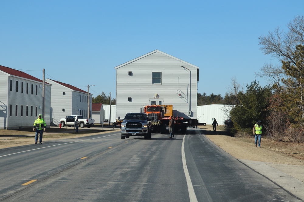 Contractors move fourth World War II-era barracks to new location in April 2023