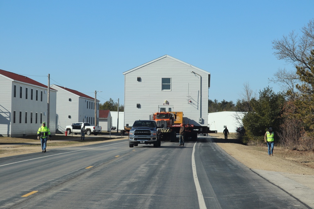 Contractors move fourth World War II-era barracks to new location in April 2023