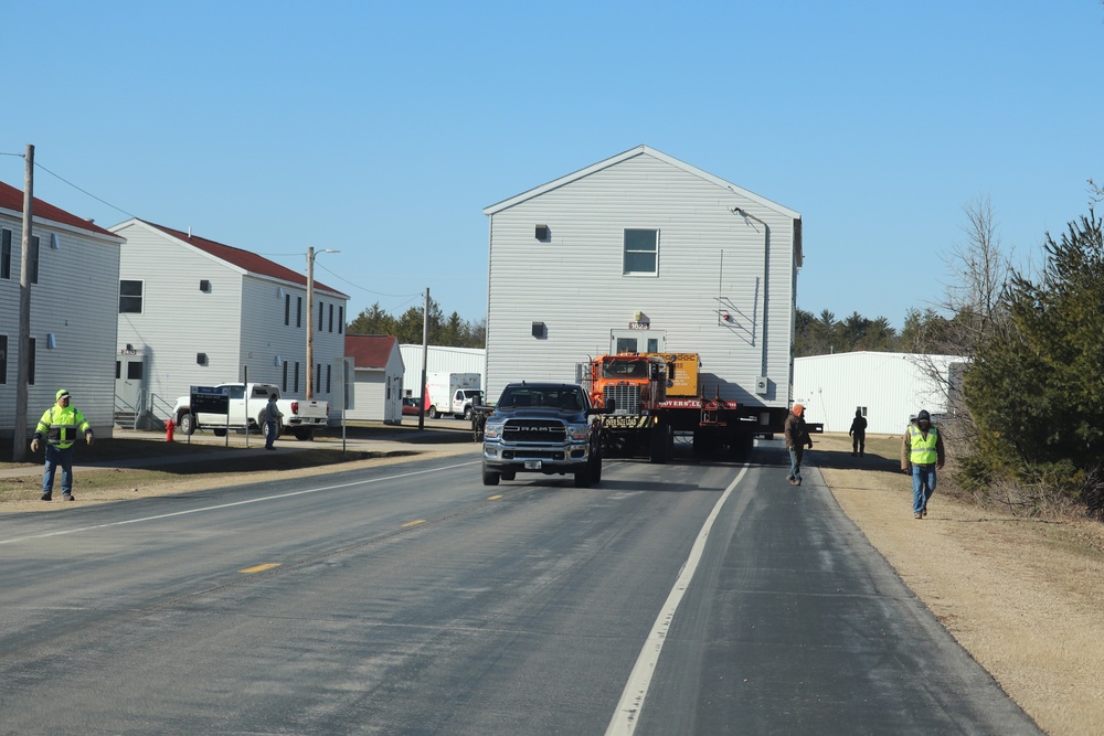 Contractors move fourth World War II-era barracks to new location in April 2023