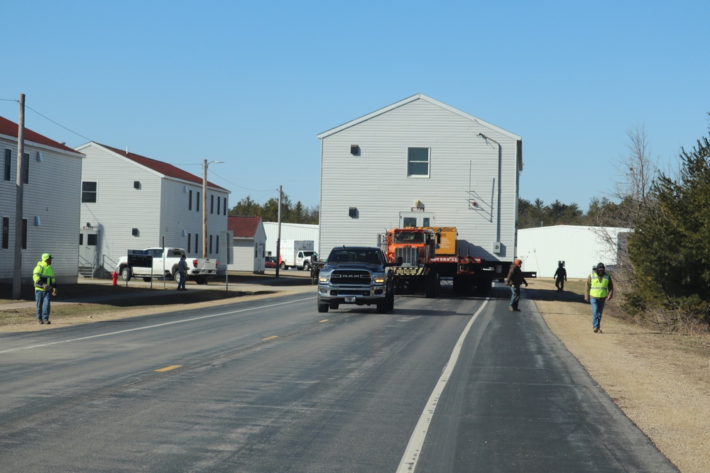 Contractors move fourth World War II-era barracks to new location in April 2023