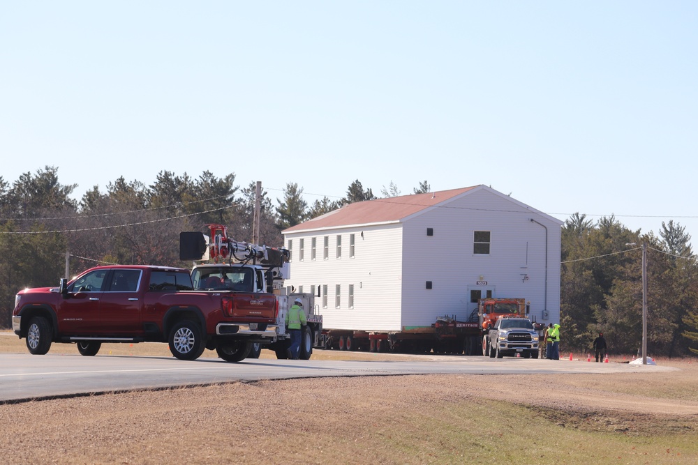 Contractors move fourth World War II-era barracks to new location in April 2023