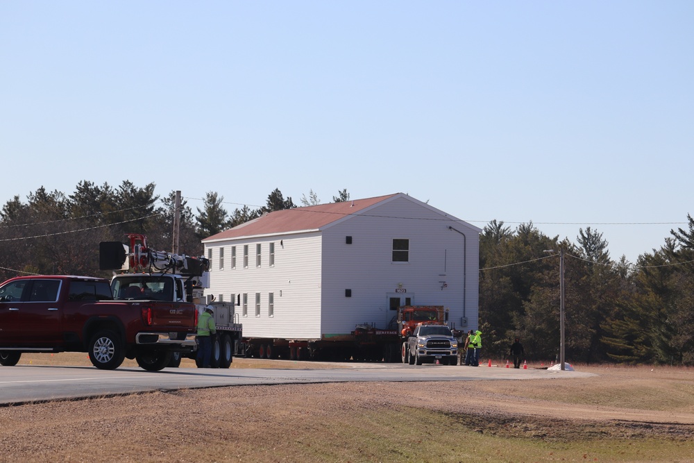 Contractors move fourth World War II-era barracks to new location in April 2023