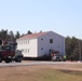 Contractors move fourth World War II-era barracks to new location in April 2023