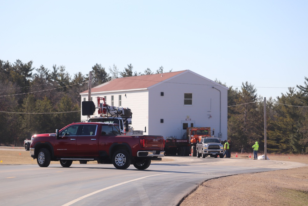 Contractors move fourth World War II-era barracks to new location in April 2023