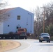 Contractors move fourth World War II-era barracks to new location in April 2023