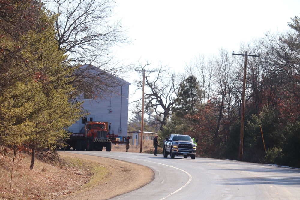 Contractors move fourth World War II-era barracks to new location in April 2023