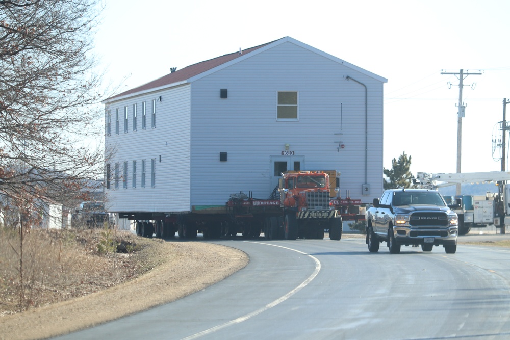 Contractors move fourth World War II-era barracks to new location in April 2023