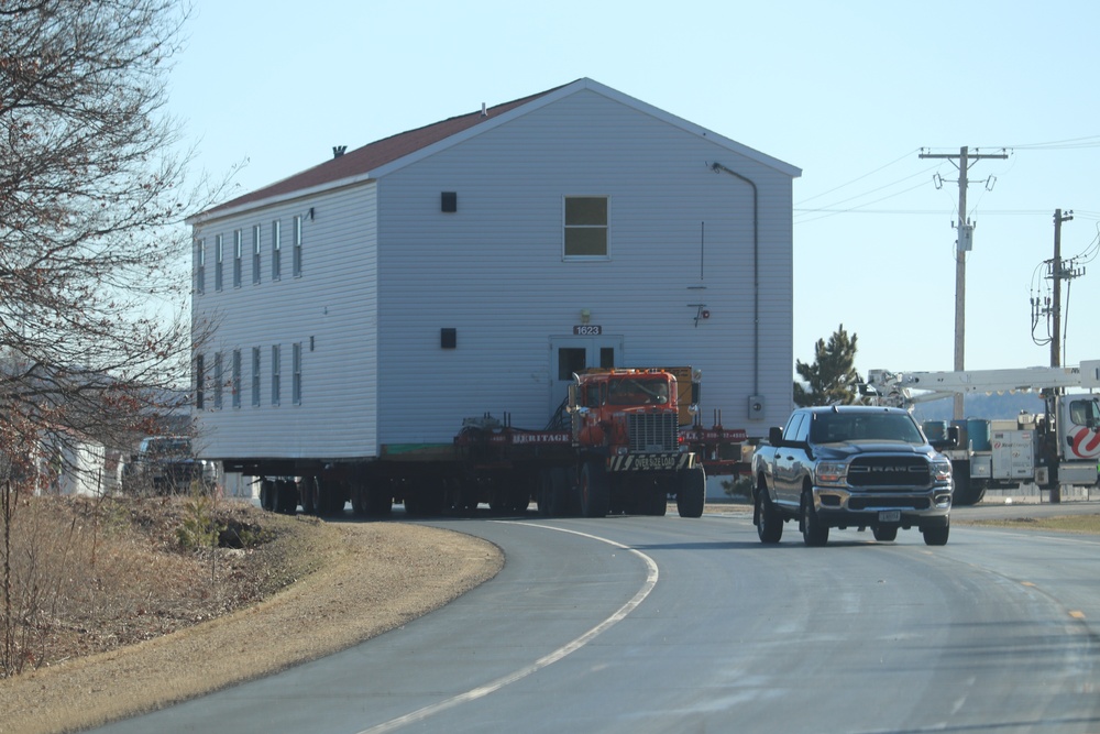 Contractors move fourth World War II-era barracks to new location in April 2023