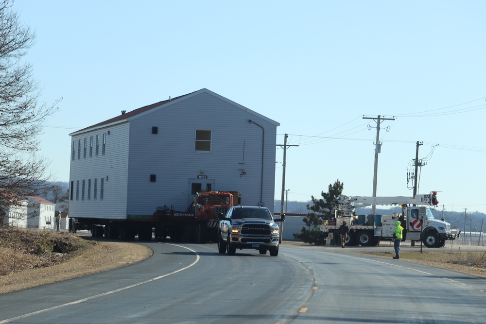 Contractors move fourth World War II-era barracks to new location in April 2023