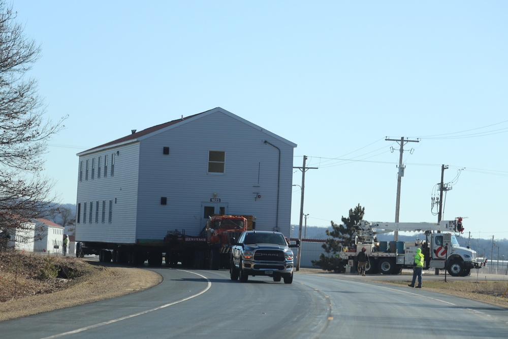 Contractors move fourth World War II-era barracks to new location in April 2023