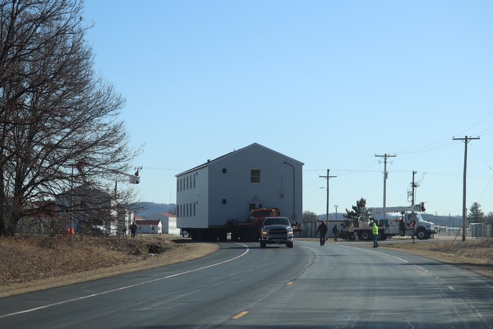 Contractors move fourth World War II-era barracks to new location in April 2023