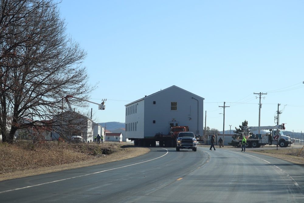 Contractors move fourth World War II-era barracks to new location in April 2023