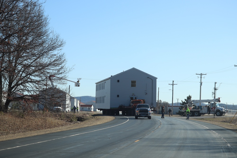 Contractors move fourth World War II-era barracks to new location in April 2023