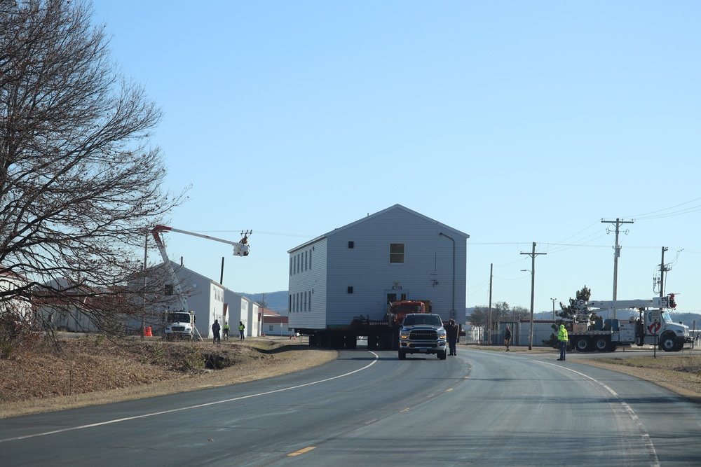 Contractors move fourth World War II-era barracks to new location in April 2023