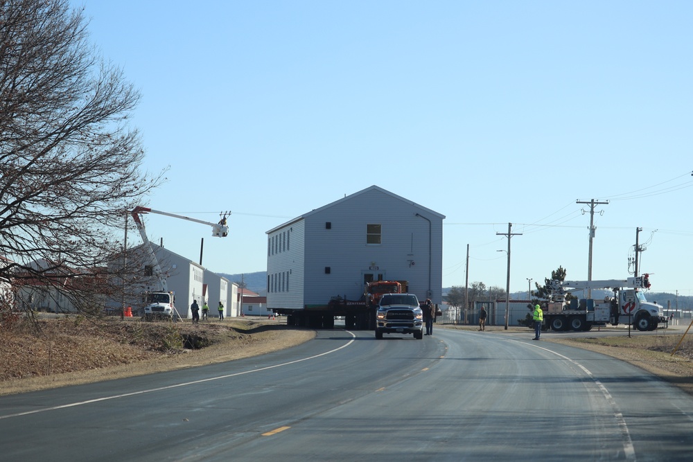 Contractors move fourth World War II-era barracks to new location in April 2023