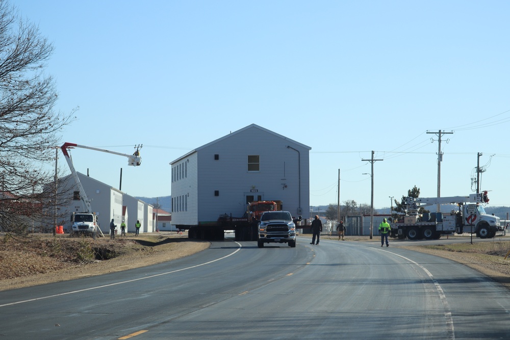 Contractors move fourth World War II-era barracks to new location in April 2023