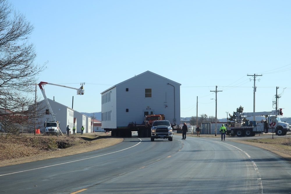 Contractors move fourth World War II-era barracks to new location in April 2023