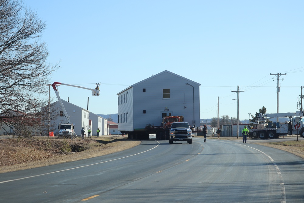 Contractors move fourth World War II-era barracks to new location in April 2023