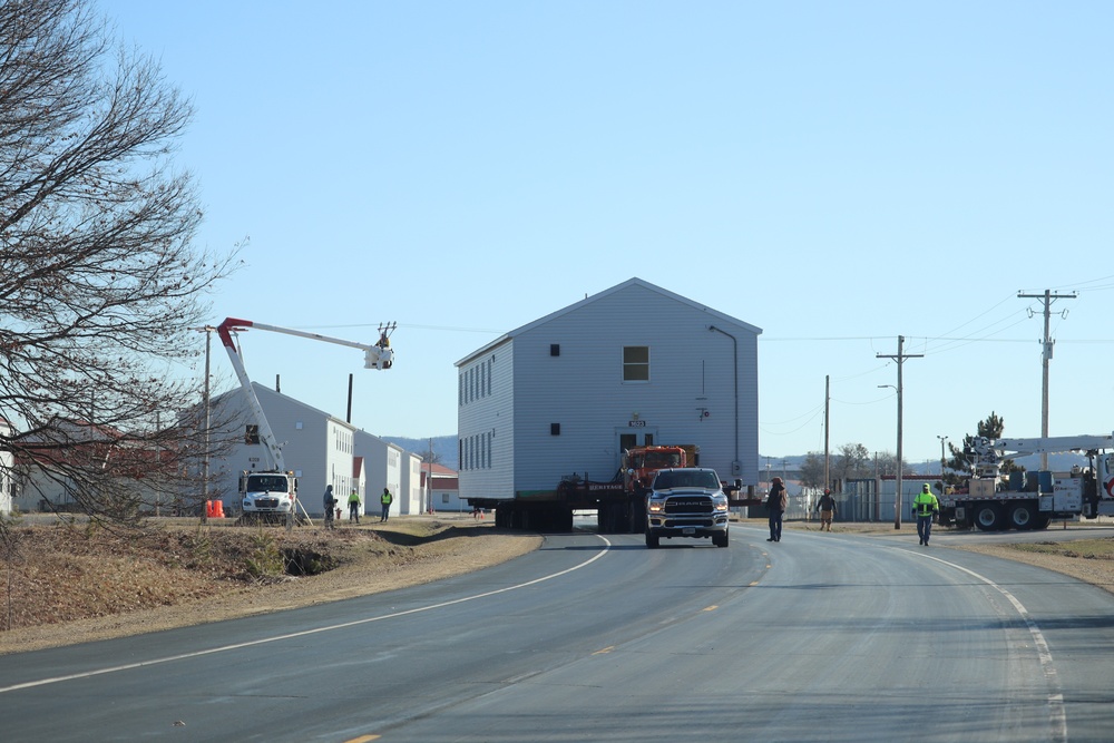 Contractors move fourth World War II-era barracks to new location in April 2023