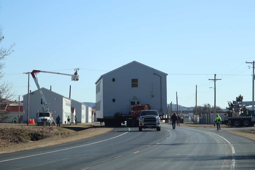 Contractors move fourth World War II-era barracks to new location in April 2023