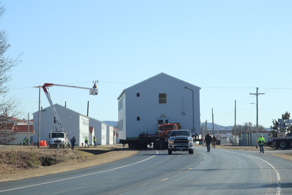 Contractors move fourth World War II-era barracks to new location in April 2023