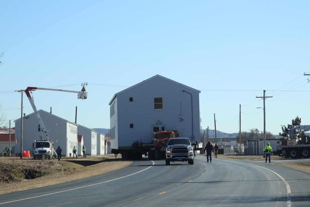 Contractors move fourth World War II-era barracks to new location in April 2023