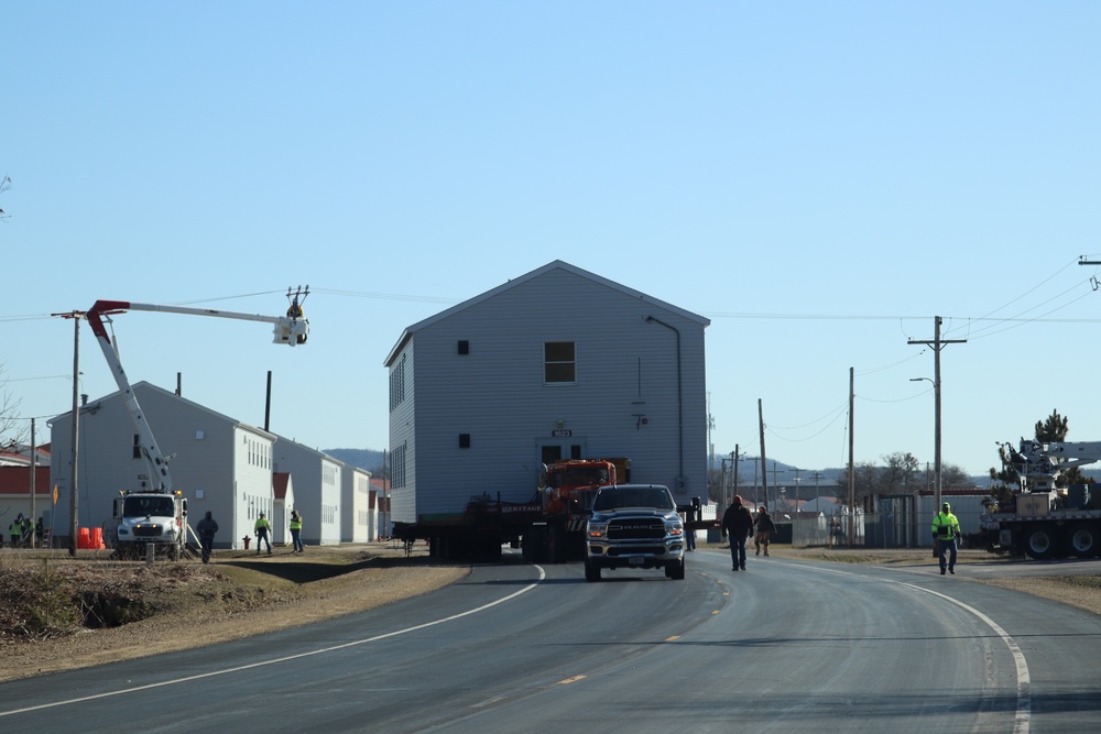 Contractors move fourth World War II-era barracks to new location in April 2023