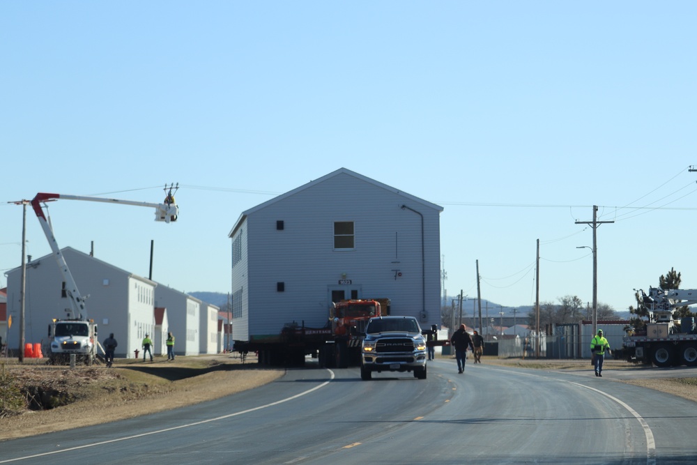 Contractors move fourth World War II-era barracks to new location in April 2023