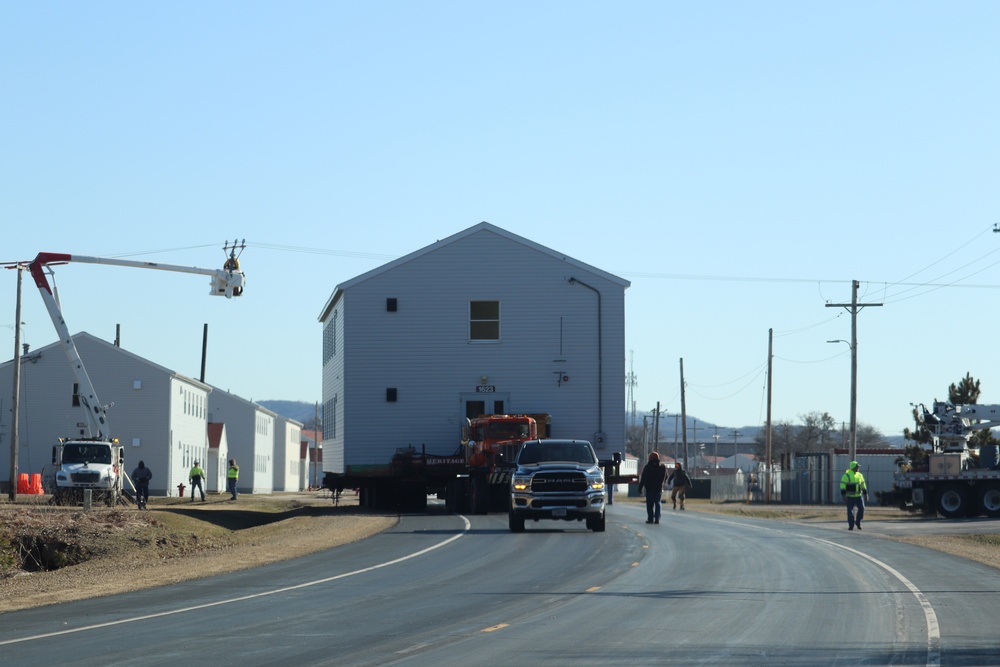 Contractors move fourth World War II-era barracks to new location in April 2023