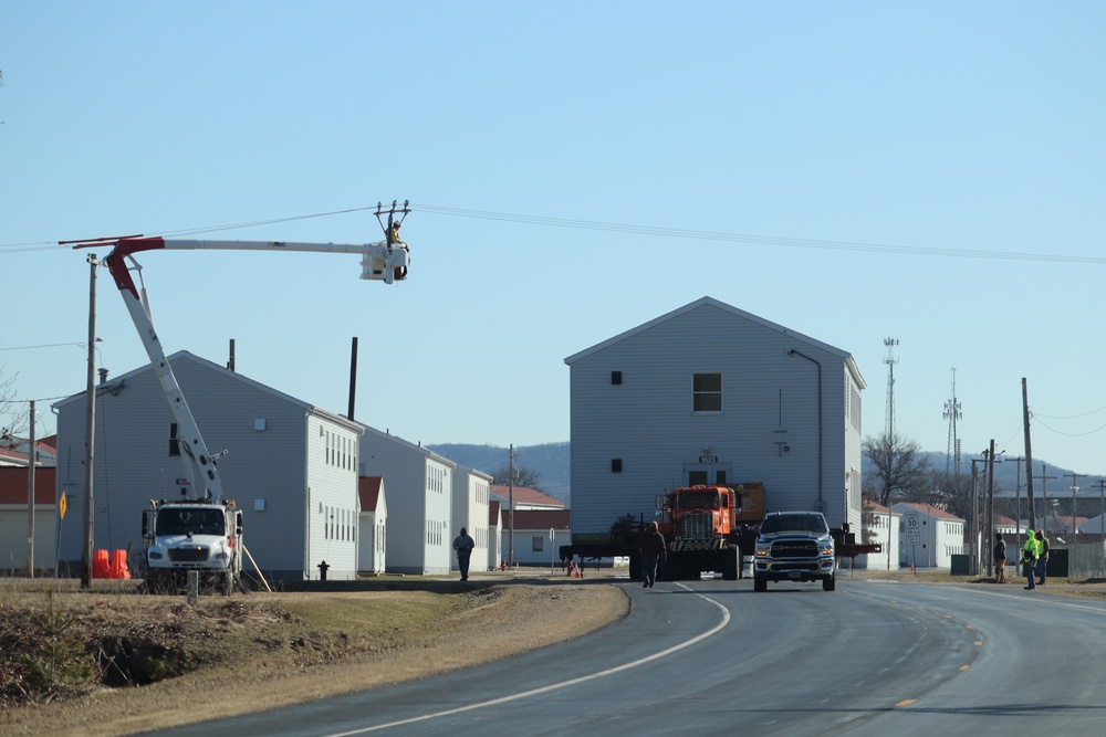 Contractors move fourth World War II-era barracks to new location in April 2023