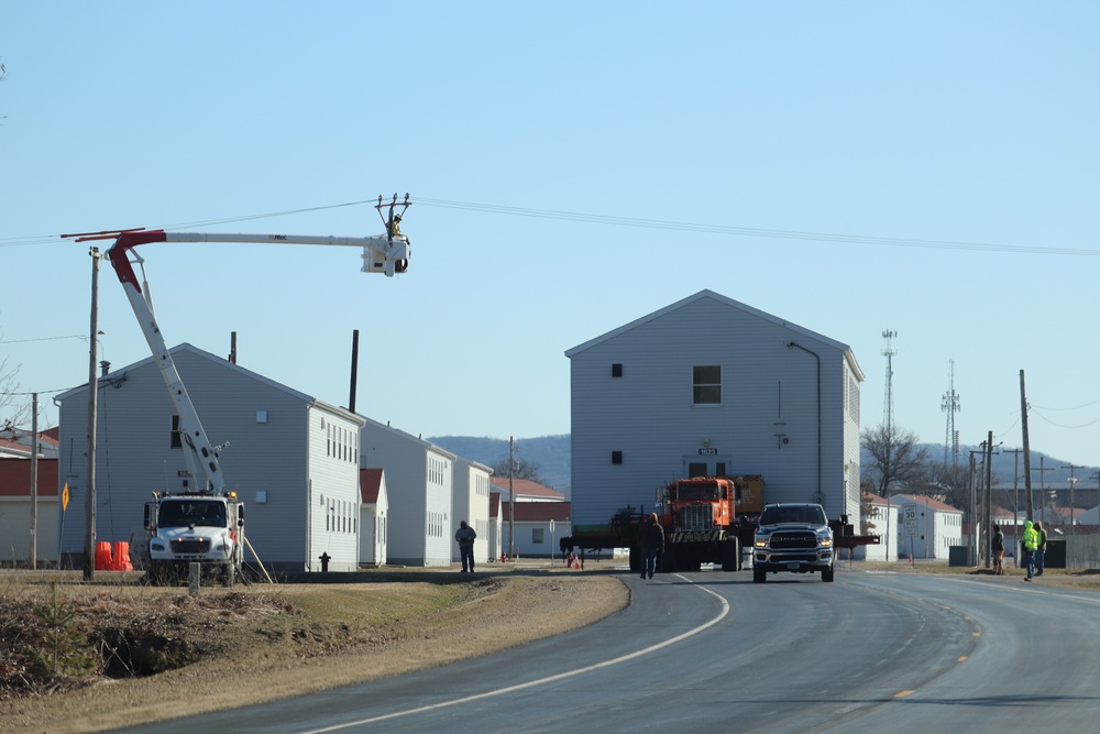 Contractors move fourth World War II-era barracks to new location in April 2023