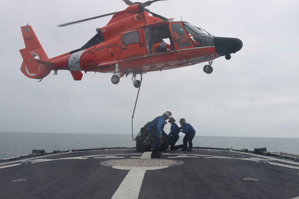 U.S. Coast Guard Cutter Alert, helicopter crews conduct at-sea vertical replenishment training