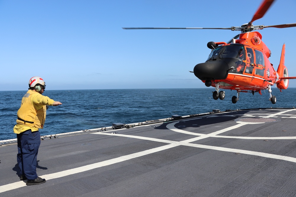 U.S. Coast Guard Cutter Alert, helicopter crews conduct at-sea vertical replenishment training