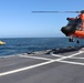 U.S. Coast Guard Cutter Alert, helicopter crews conduct at-sea vertical replenishment training