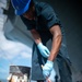 Tripoli Sailors Paint Anchor and Chain During Ongoing SRA