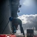 Tripoli Sailors Paint Anchor and Chain During Ongoing SRA