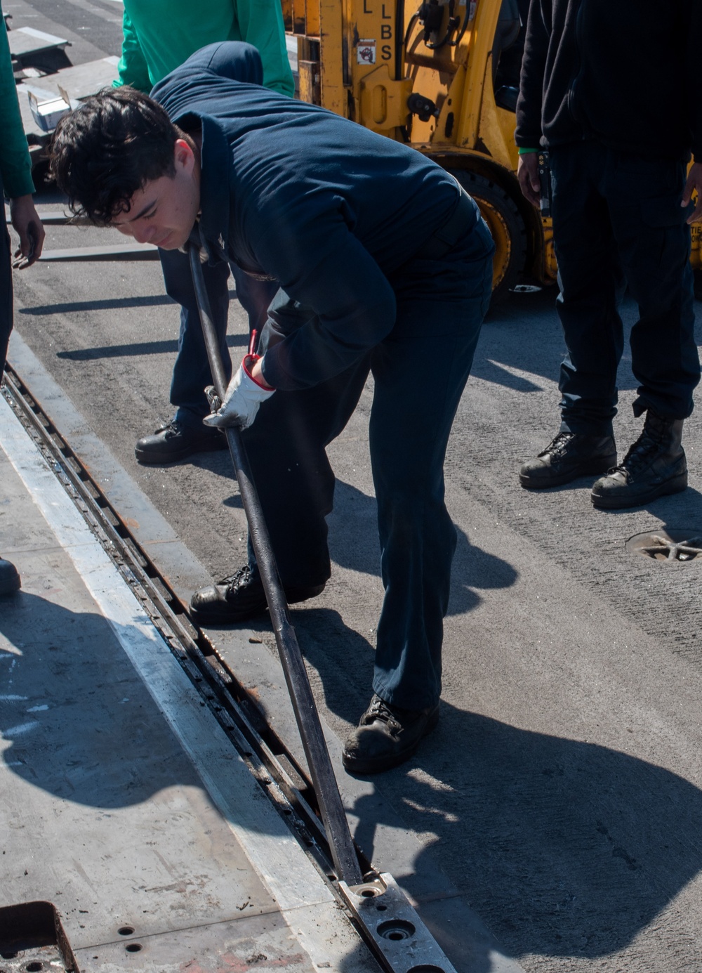 USS Ronald Reagan (CVN 76) Sailors perform catapult maintenance
