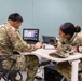 Soldiers from 10th Mountain Division (LI) coordinate locations on a map to pinpoint emitter locations May 2, 2023, around Fort Drum, NY.