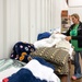 Volunteer Sorts Generous Donations for Tornado Survivors