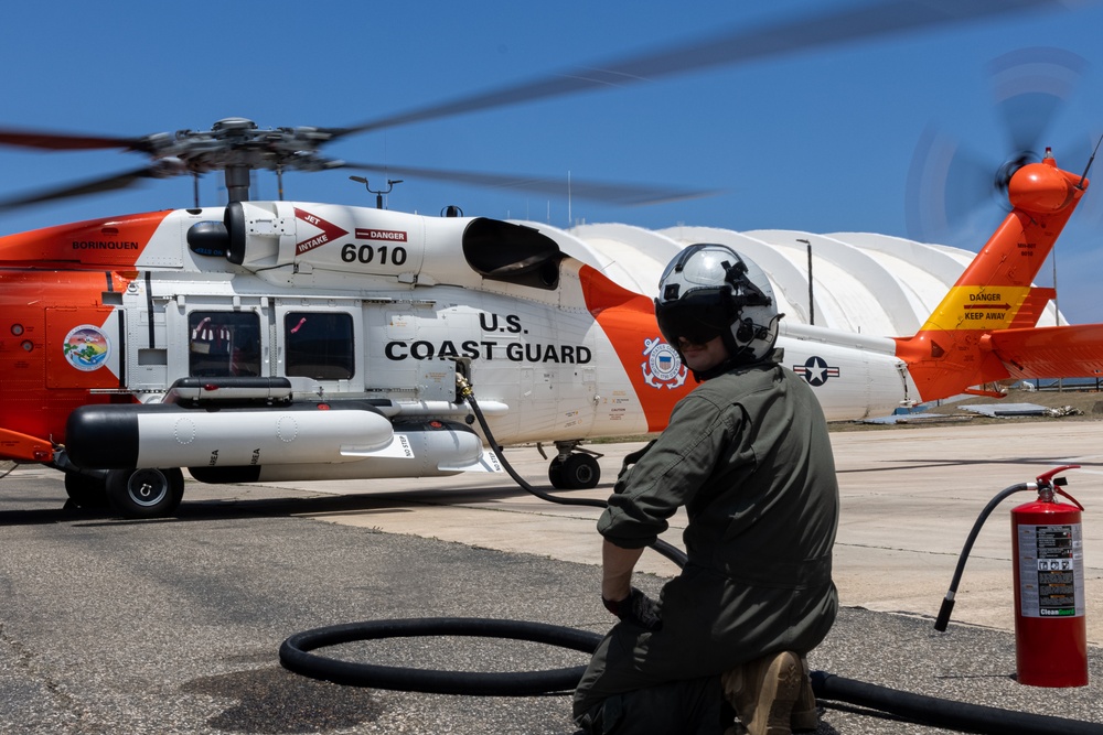 VMGR-252 conducts ground refueling on a U.S. Coast Guard HH-60 Jayhawk