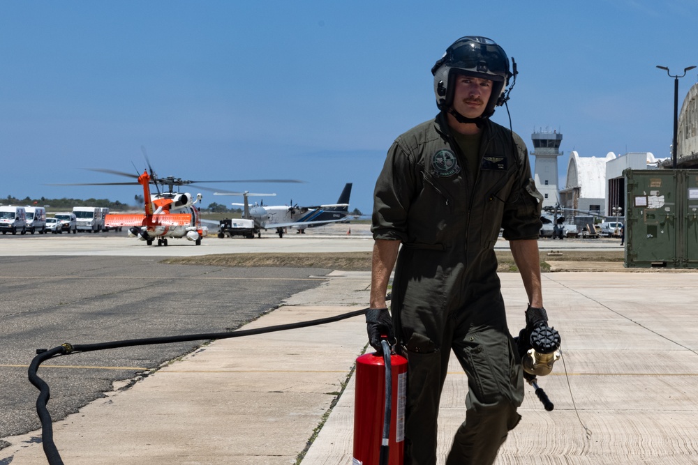VMGR-252 conducts ground refueling on a U.S. Coast Guard HH-60 Jayhawk