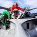 Sailors work on flight deck