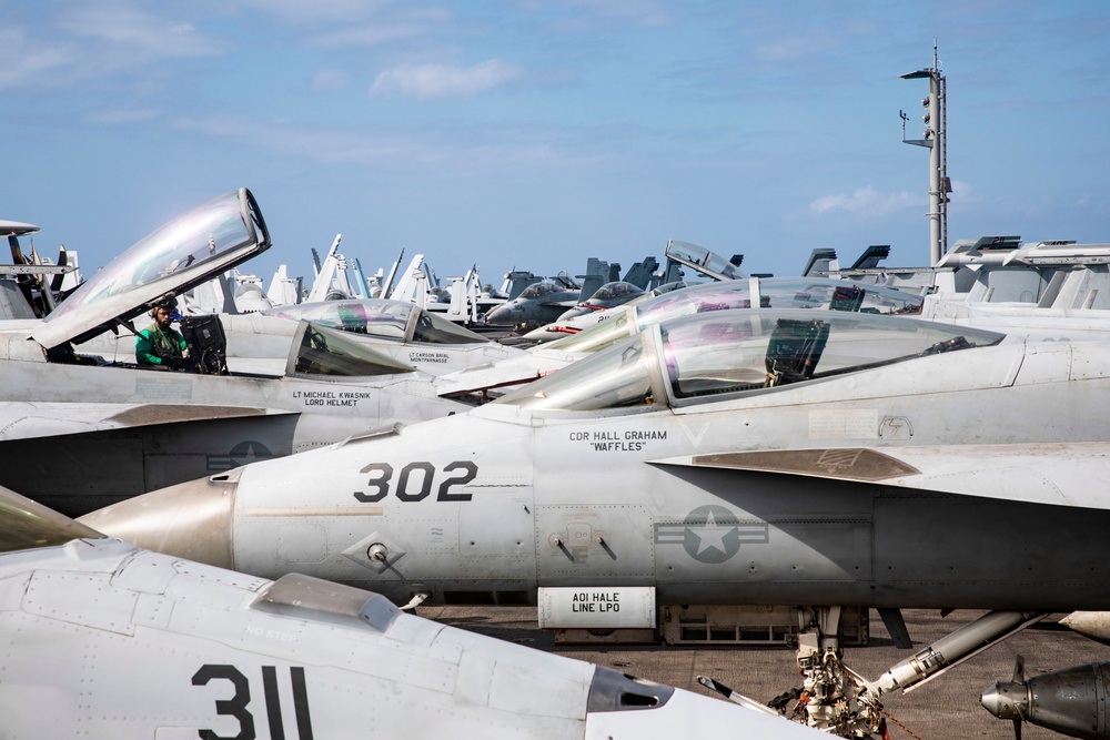 Sailors work on flight deck