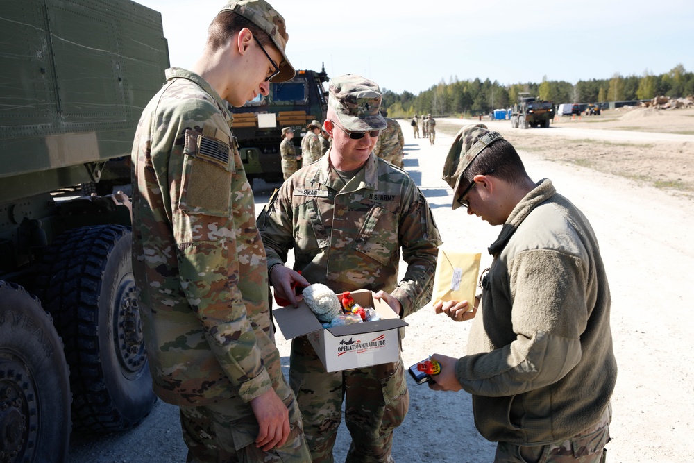 1-182FA Chaplain hands out care packages delivered by Operation Gratitude