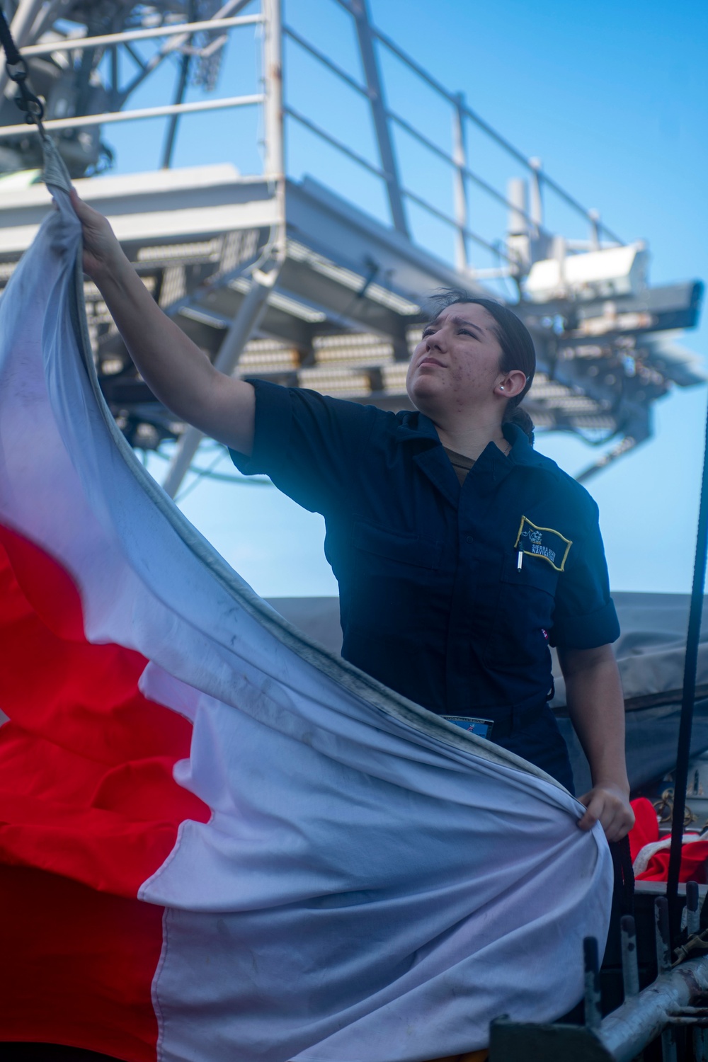 Sailor Hauls Down Flag