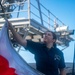 Sailor Hauls Down Flag